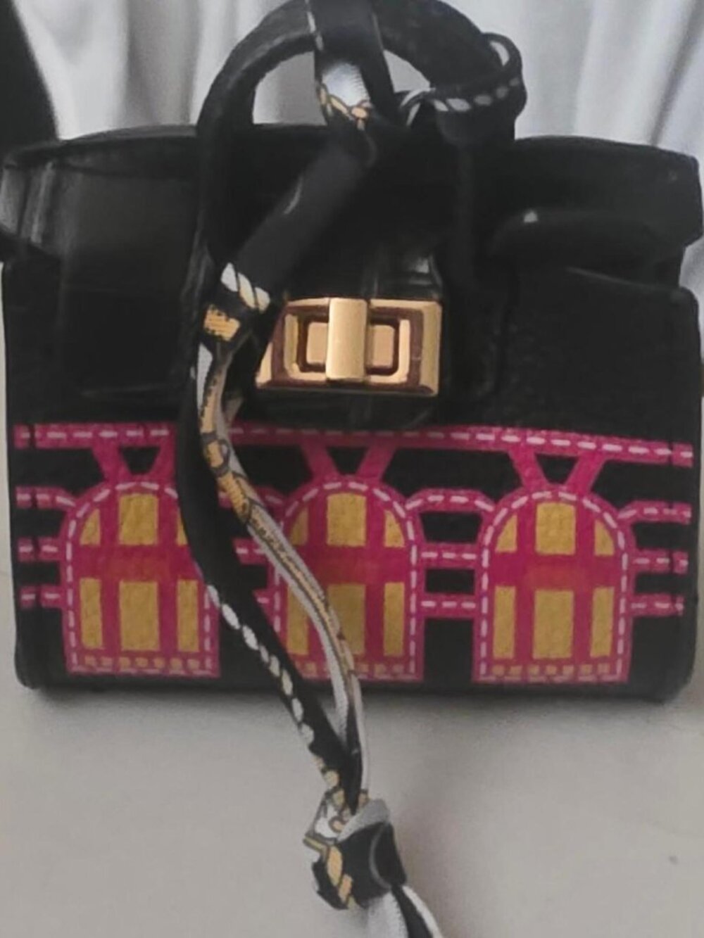 Black Mini Handbag with Pink and Yellow Arched Window Design
